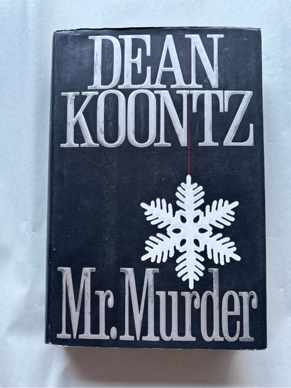 Dean Koontz Mr. Murder book cover with white snowflake graphic